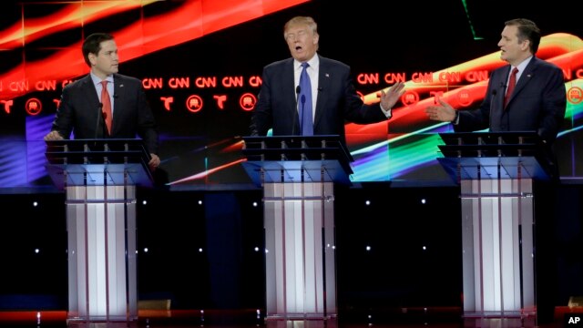 Republican presidential candidate, businessman Donald Trump, center, reacts to Republican presidential candidate, Sen. Ted Cruz, R-Texas, right, as Republican presidential candidate, Sen. Marco Rubio, R-Fla., looks on during a Republican presidential prim
