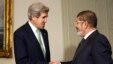 U.S. Secretary of State John Kerry (L) shakes hands with Egypt
