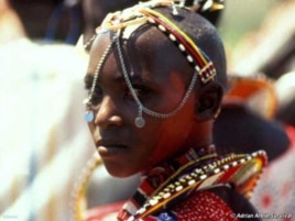 A young Massai woman in traditional dress