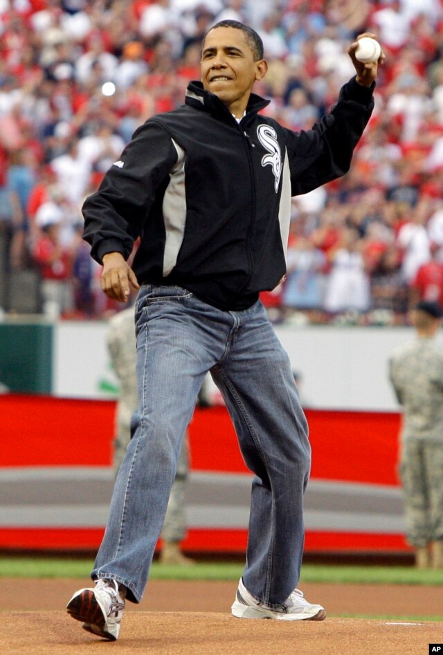 President Obama wears jean as he throws out the first pitch.