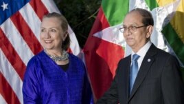 U.S. Secretary of State Hillary Rodham Clinton, left, and Burma President Thein Sein shake hands before a meeting at Le Meridien Hotel in Siem Reap, Cambodia, July 13, 2012.