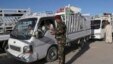 Iraqi security forces check identification documents at a checkpoint near the entrance to Ramadi, 70 miles (115 kilometers) west of Baghdad, April 3, 2016. 