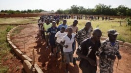 Malian women and men run during a training session at the FLN movement (North Liberation Forces) camp in Sevare, Mali, September 24, 2012.