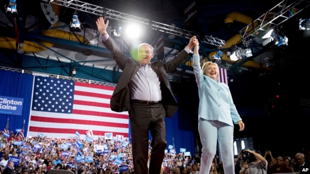 Democratic presidential candidate Hillary Clinton and Sen. Tim Kaine, D-Va., arrive at a rally at Florida International University Panther Arena in Miami, Saturday, July 23, 2016. 