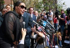 Marvin Gaye's daughter, Nona Gaye, left, talks to the media outside the Los Angeles U.S. District Court after a jury awarded the singer's children nearly $7.4 million in copyright claim, March 10, 2015.