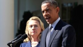 President Barack Obama delivers a statement alongside Secretary of State Hillary Clinton, following the death of the U.S. Ambassador to Libya, Chris Stevens, and others, from the Rose Garden of the White House in Washington, September 12, 2012