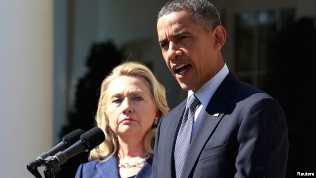 President Barack Obama delivers a statement alongside Secretary of State Hillary Clinton, following the death of the U.S. Ambassador to Libya, Chris Stevens, and others, from the Rose Garden of the White House in Washington, September 12, 2012