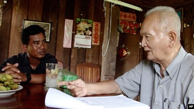 Thet Sambath, filmmaker of the 'Enemies of the People', speaking to former Khmer Rouge leader Nuon Chea. 