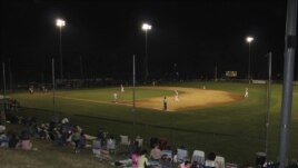 Fans gather to watch the Orleans Firebirds during the Cape Cod Baseball League's summer season. (VOA/D. Gruenbaum)