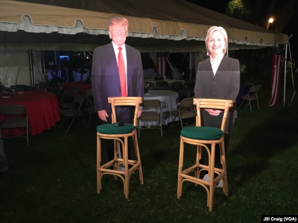 Cardboard cutouts of both candidates on display during a breakfast at the home of U.S. ambassador in Nairobi, Kenya.