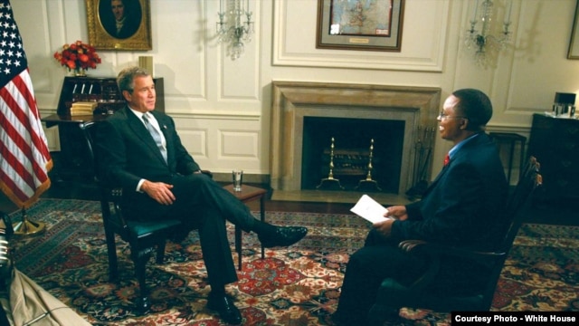 Vincent Makori interviews U.S. President George W. Bush at the White House in 2003. Makori did the interview before joining the president on a five-nation African trip.