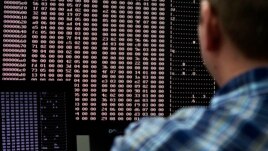 An analyst looks at code in the malware lab of a cyber security defense lab at the Idaho National Laboratory in Idaho Falls, Idaho September 29, 2011. REUTERS/Jim Urquhart (UNITED STATES - Tags: BUSINESS LOGO CRIME LAW MILITARY POLITICS SCIENCE TECHNOLOGY