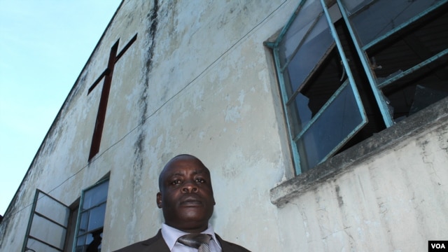 Reverend Miltone Mudegu outside his church, which was attacked by Muslim youths during riots in August, Mombasa, Kenya, November 18, 2012. (H. Heuler/VOA)
