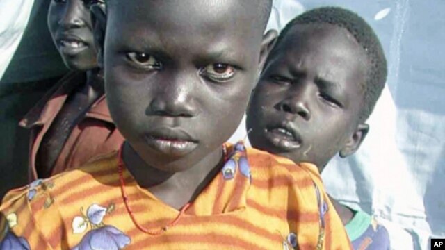 Children in then unified Sudan await food aid in 2009. Officials say Eastern Equatoria needs food aid to avoid disaster. (File)
