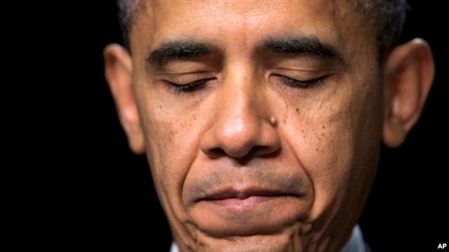 President Barack Obama pauses as he speaks at the National Prayer Breakfast, Washington, Feb. 7, 2013.