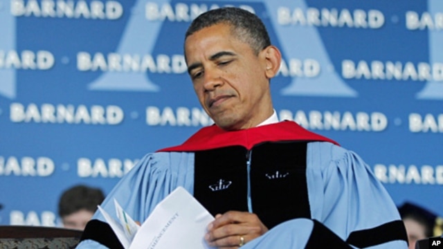 President Barack Obama reads over a program before delivering the commence address at Barnard College, New York, May 14, 2012.