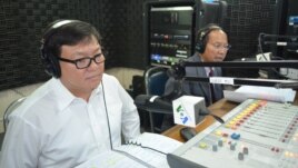 Son Chhay, left, is a member of parliament of Sam Rainsy Party and Phay Siphan, right, is a spokesman of Council of Ministers of Cambodia. 