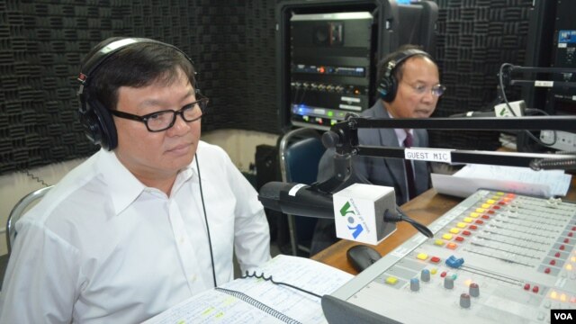 Son Chhay, left, is a member of parliament of Sam Rainsy Party and Phay Siphan, right, is a spokesman of Council of Ministers of Cambodia. 