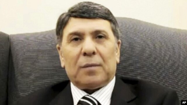 This image made from amateur video and released by Aljizahnews Thursday, March 8, 2012, purports to show a deputy to Syria's oil ministry who identifies himself as Abdo Husameddine at an unidentified location.