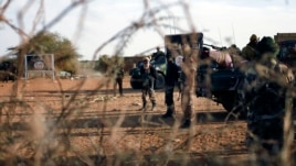 French and Malian troops man a checkpoint at the entrance of Gao, northern Mali, Feb. 11, 2013.