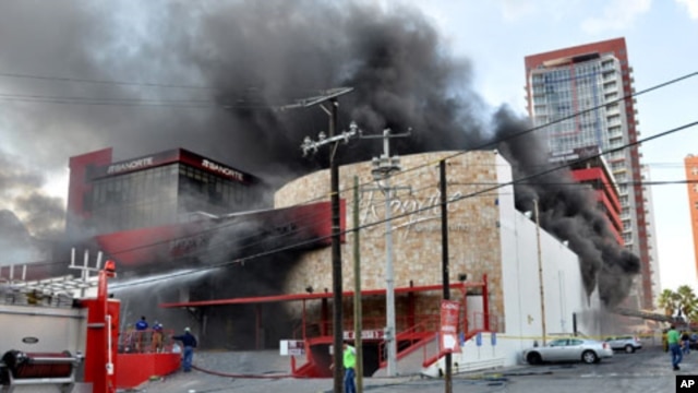 Smoke billows from the Casino Royale in Monterrey, Mexico, August 25, 2011