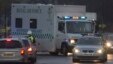A convoy carrying a female Ebola patient arrives at the Royal Free Hospital in London Dec. 30, 2014.