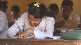 A girl sits in a history class at the local high school in, Cambodia.