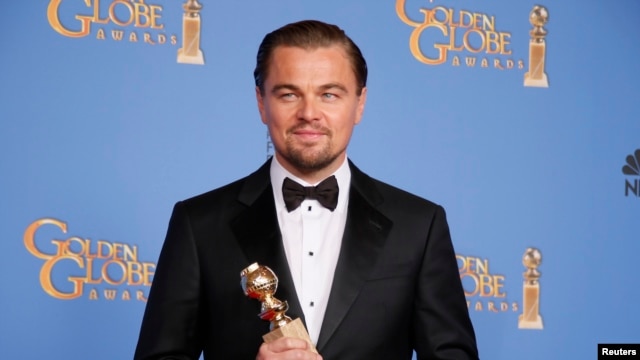 Actor Leonardo DiCaprio poses with the award for Best Actor in a Motion Picture, Musical or Comedy for his role in "The Wolf of Wall Street" backstage at the 71st annual Golden Globe Awards in Beverly Hills, California, Jan. 12, 2014.