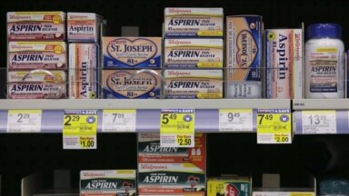 Packages of aspirin fill the shelves of a drugstore, Tuesday, Aug. 11, 2009 in Chicago