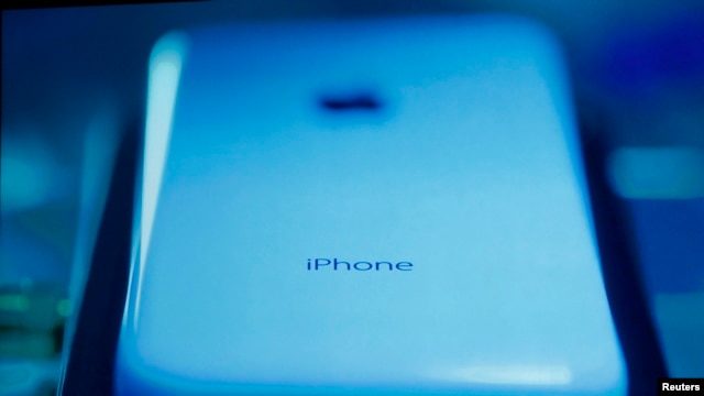The new iPhone 5C is seen on screen at Apple Inc's media event in Cupertino, California Sept 10, 2013. 