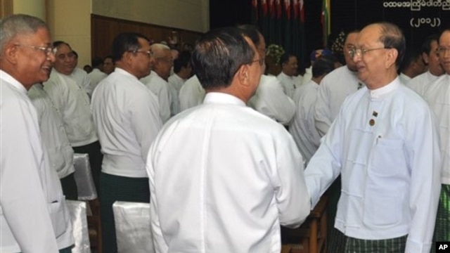 Burmese President Thein Sein, right, greets fellow Union Solidarity and Development Party members, Naypyitaw, Oct. 14, 2012.