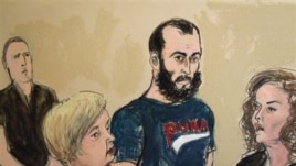 In this courtroom sketch, Agron Hasbajrami, center, is arraigned on a charge of providing material support to terrorists Friday, Sept. 9, 2011 in Brooklyn Federal Court in New York. The government alleges that since 2010, Hasbajrami, an Albanian citizen a