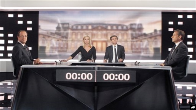 Socialist Party candidate for the presidential election Francois Hollande, left, and current President and conservative candidate for re-election Nicolas Sarkozy , right, pose before a televised debate in Paris,  May, 2, 2012. 
