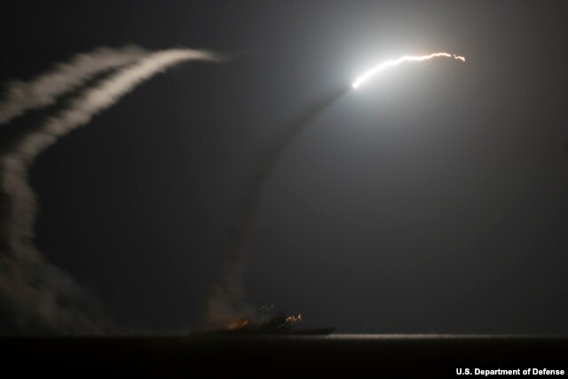 FILE - The guided-missile cruiser USS Philippine Sea launches a Tomahawk cruise missile as seen from the aircraft carrier USS George H.W. Bush, Sept. 23, 2014. Such tools are used by the U.S. military to combat surface-to-air missiles. (U.S. Navy photo by Mass Communication Specialist 1st Class Eric Garst/Released)