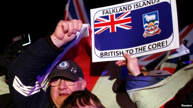 Falkland islanders react after hearing the results of the referendum in Stanley, March 11, 2013. 