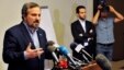 Louay al-Safi, spokesman for the Syrian National Coalition (L), speaks during a news conference in Istanbul May 26, 2013. 
