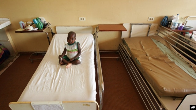 FILE - A sick child in a Dakar hospital.