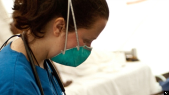 Physician Megan Coffee uses HealthMap in Haiti.