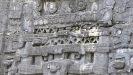 Stone monuments like this stucco frieze in Caracol, Belize, document Maya battles, births and burials. (Photo image of Douglas Kennett, Penn State)