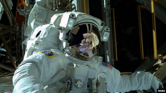 Astronaut Mike Hopkins is seen during a spacewalk in an image from NASA.