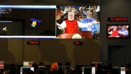 ISRO scientists and engineers watch Prime Minister Narendra Modi.