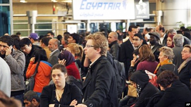 Passengers wait for check-in at Cairo's international airport, Egypt, January 31, 2011