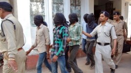 Police escort men accused of a gang rape to a court in Datia district in the central Indian state of Madhya Pradesh, March 18, 2013.