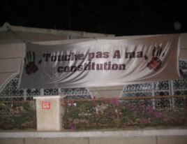 Senegalese demonstrate against President Wade's decision to run for re-election with signs reading “Don’t touch my constitution!” (December 2011)