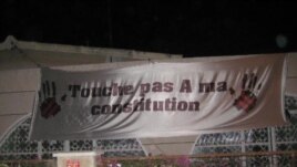 Senegalese demonstrate against President Wade's decision to run for re-election with signs reading “Don’t touch my constitution!” (December 2011)