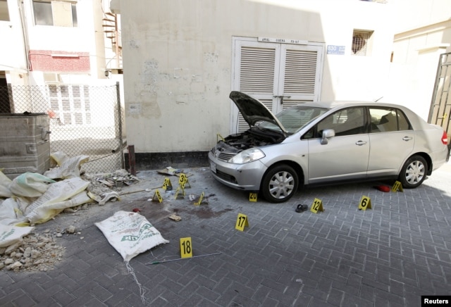 Crime scene markers are seen at a bomb site in capital of Manama, Bahrain, November 5, 2012. Five bombs exploded in the heart of Manama Monday, killing two people, officials said.