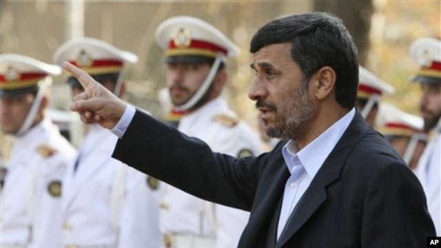Iranian President Mahmoud Ahmadinejad gestures prior to an official welcoming ceremony for Qatari Emir Sheik Hamad Bin Khalifa Al Thani, unseen, in Tehran, Iran, 20 Dec 2010