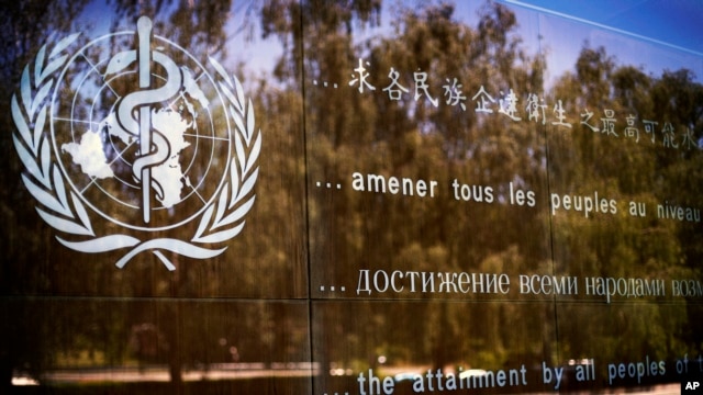 FILE - The logo of the World Health Organization is seen at the WHO headquarters in Geneva, Switzerland.