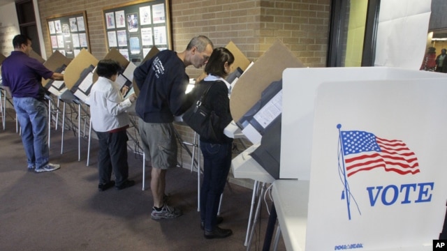 People vote early at the Salt Lake County Government Building in Salt Lake City, October 30, 2012.