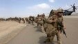 FILE - U.U.S. Marines prepare to depart at the end of operations for Marines and British combat troops in Helmand, Afghanistan, Oct. 27, 2014. 